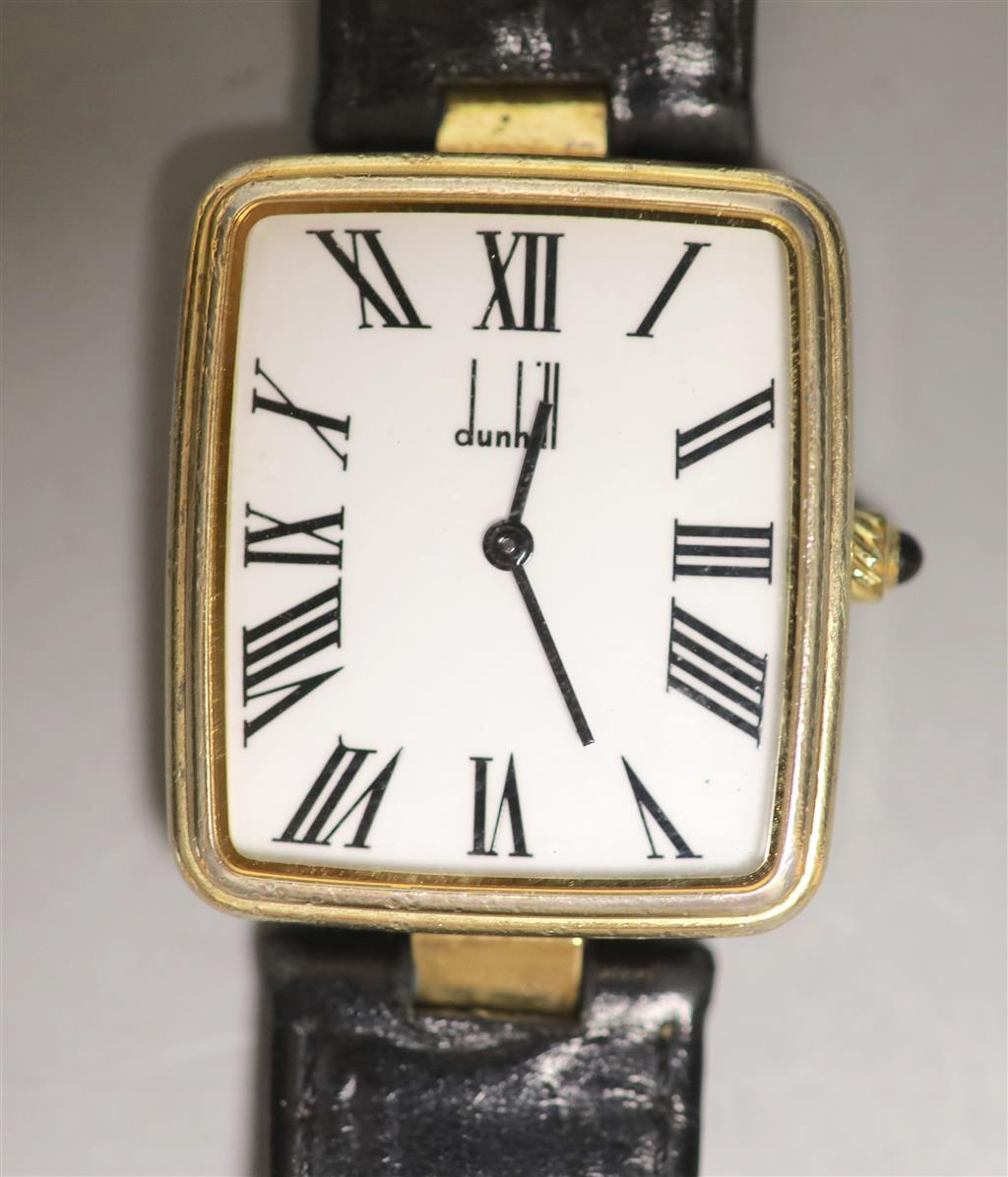 A gentlemans silver gilt Dunhill quartz shaped rectangular dial wrist watch, on a leather strap with Dunhill clasp,